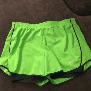 Green Nike running shorts